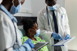 Doctors attending to an emergency about a dental care patient -Dental Emergencies in egbeda